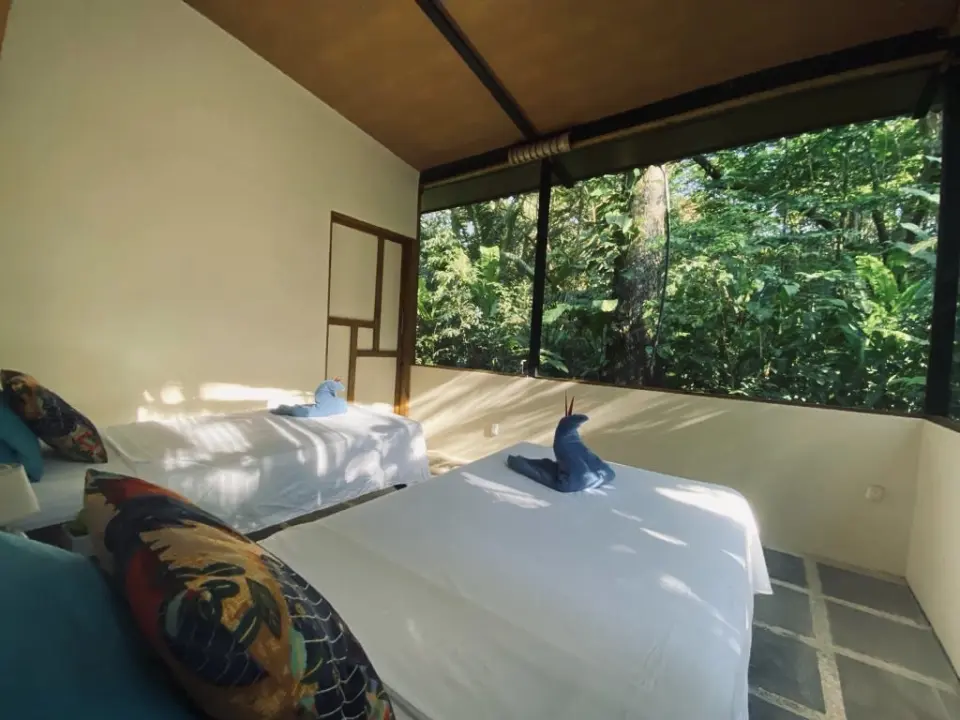 Black machined steel pen with hexagonal grip and small white logo at top.